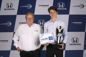 Max Crawford, Chief Executive Officer at Ligier Automotive presents Jason with his 3rd Place year end trophy at the FR Americas Awards Banquet on November 4, 2022.